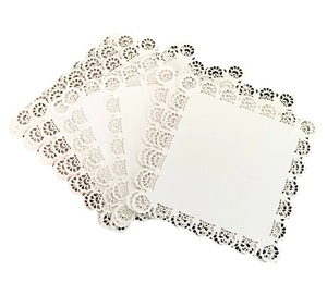 White square paper doilies with intricate lace patterns for DIY crafts and nail art