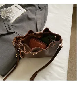 Internal view of the brown leather bucket bag showing spacious storage capacity