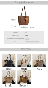 Detail view of large PU leather tote bag with bear charm showing 33x27x11cm dimensions