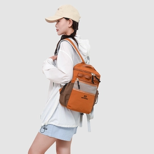Side view of orange and brown outdoor backpack featuring mesh pocket and water bottle holder
