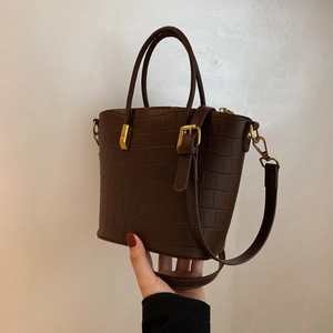 Deep brown crocodile embossed tote bag with gold hardware and removable shoulder strap