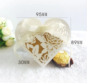 Detailed dimensions of ivory heart hollow candy box with 95mm width and laser-cut patterns