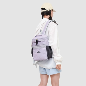 Close-up of lilac outdoor backpack with mesh pockets and durable brand metal zippers