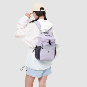 Detail view of the lavender backpack side mesh pocket and Northansen logo on fabric