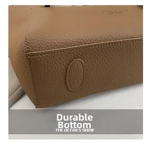 Macro shot of durable brown lychee-patterned leather base with reinforced stitching