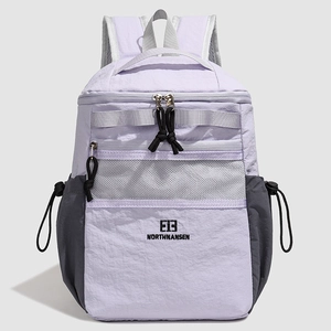 Detailed view of lightweight purple backpack with front mesh pocket and side toggles