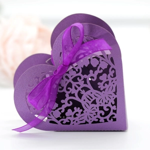 Purple heart-shaped laser cut wedding favor box with hollow vine pattern and silk ribbon