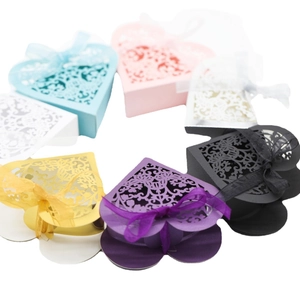 Hollow heart laser-cut candy boxes with organza ribbons in multiple bright colors