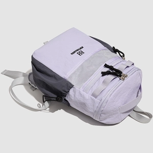 Detail of color-block nylon backpack with lavender mesh pocket and NORTHHANSEN logo