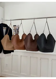 Detailed display of woven hobo bucket bags available in beige, brown, and black colors