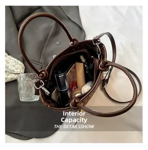Detailed interior view of leopard print bucket bag showing capacity for cosmetics