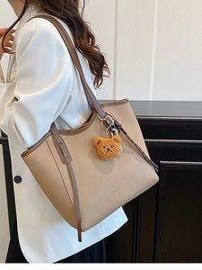 Vintage large-capacity beige tote bag in lychee leather with brown straps and bear charm