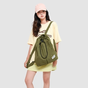 Detail of army green nylon drawstring backpack with pleated texture and brand tag