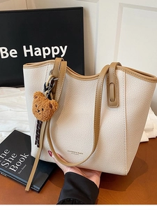 Retro cream white pebble leather tote bag with brown handles and plush bear charm