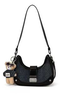 Navy denim crescent shoulder bag with black leather trim and cute bear keychain charm