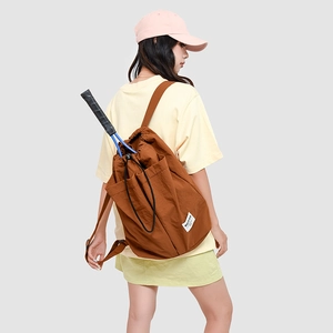 Rear view of a brown drawstring backpack with a tennis racket inside for sports use