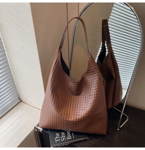 Detail of dark brown woven texture and hobo structure on a large tote bag
