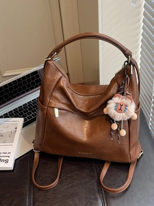 Dark brown large PU leather tote bag with side pockets and a cute sheep plush charm
