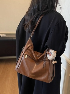 Brown large capacity PU leather shoulder bag with plush lamb charm and glossy texture
