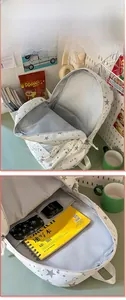Internal view of the white star pattern backpack showing spacious laptop compartment