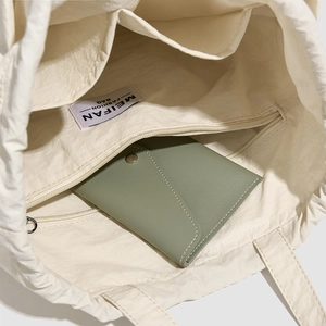 Interior view of large nylon backpack with zipper pockets and spacious compartments