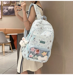 Light blue school backpack with star patterns and clear window detail for badges