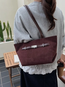 Minimalist dark burgundy suede tote bag with leather strap and silver buckle accent