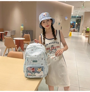 Light blue school backpack with transparent star pocket and large capacity storage