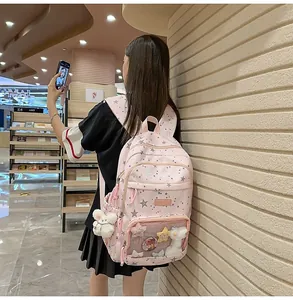 Detailed side view of pink starry backpack with transparent DIY pocket and plush rabbit
