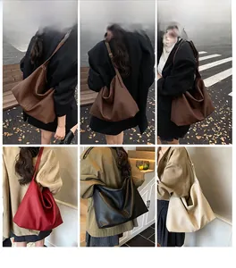 Detail view of large capacity faux leather tote bags in brown, red, black, and beige colors
