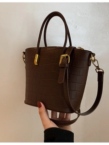Deep brown crocodile embossed tote bag with gold hardware and adjustable strap