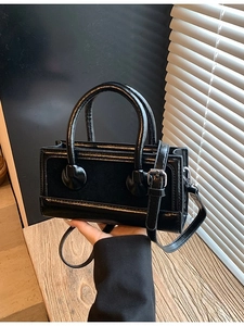 Retro black rectangular handbag in matte leather with top handles and silver hardware