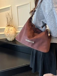 Retro dark brown suede crescent shoulder bag with vintage wooden bead and logo plate