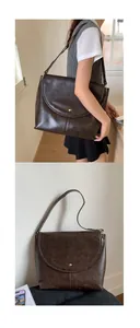 Détail d'un sac cabas en cuir marron vintage avec une boucle magnétique dorée raffinée