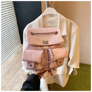 Close-up of light pink backpack with metal turn-lock and chain strap detail