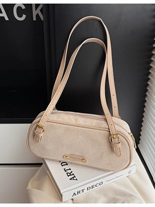 Minimalist beige suede Boston shoulder bag with adjustable straps and metal logo