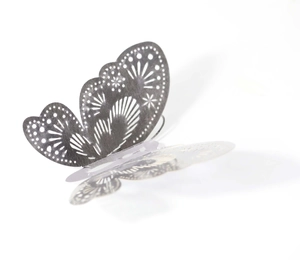 Detail of 3D rose gold reflective butterfly wall sticker with hollow geometric pattern