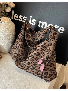 Large leopard print tote bag with pink charms and matte texture for autumn winter fashion