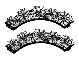 Close-up of black spider web laser cut cupcake wrappers for Halloween party decoration