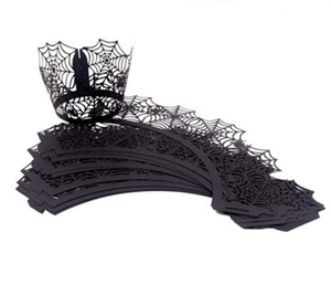Detailed laser-cut spider web pattern on black Halloween cupcake wrappers and liners