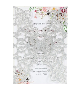 Detail of silver glitter laser-cut butterfly invitation with floral inside card