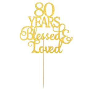 Detailed view of golden glitter 80 Years Blessed and Loved birthday cake topper on wooden stick