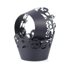 Hollow laser-cut black Halloween cupcake wrappers featuring bats and pumpkin designs