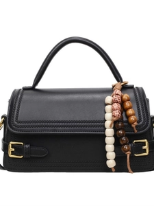 Vintage black leather crossbody bag with woven trim, golden buckle and wood bead charm