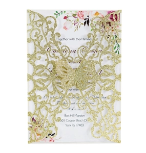Detail of laser-cut gold glitter butterfly invitation card with floral inner insert sheet