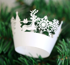 Detailed laser-cut Christmas cupcake wrapper with reindeer and snowflake paper patterns