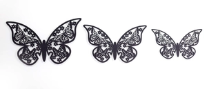 Three-piece set of black laser-cut hollow butterfly wall decorations in various sizes