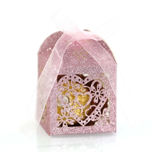 Pink glitter favor box with hollow heart design and light pink ribbon for weddings