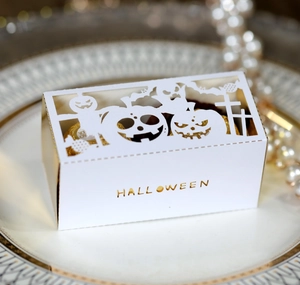 Laser cut Halloween hollow candy box with pumpkin pattern and golden liners