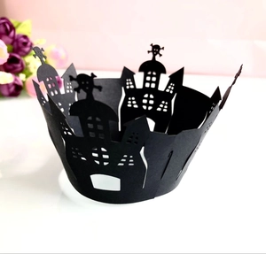 Detailed laser-cut black Halloween cupcake wrapper featuring spooky ghost castle and skull